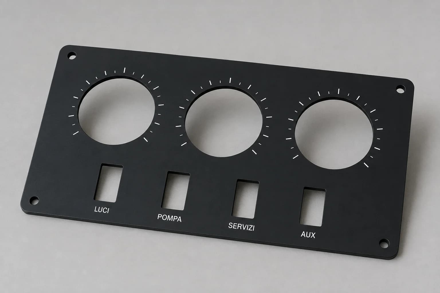 Esempio illustrativo di pannello strumenti nero con aperture circolari, sedi per interruttori e scritte bianche